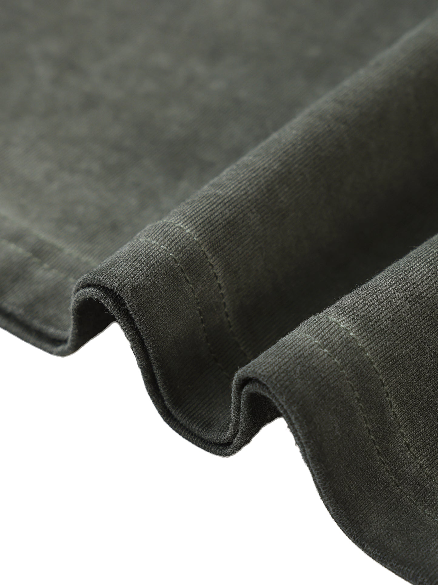 Close-up of dark gray fabric with a textured surface
