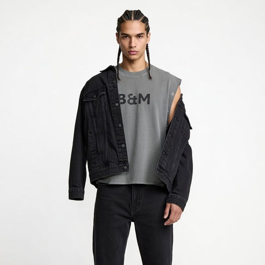 Portrait of a mixed-race man wearing a sleeveless tank with distressed grommet details, designed for both comfort and style.