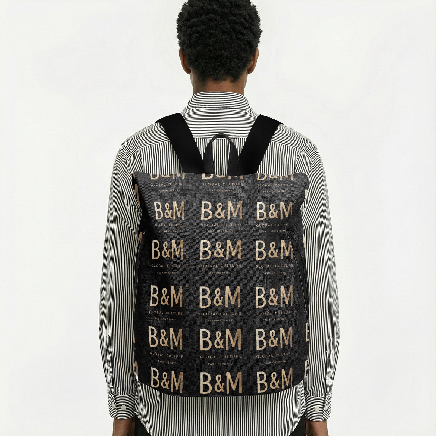 Person wearing a black backpack with 'B&M' pattern on a white background